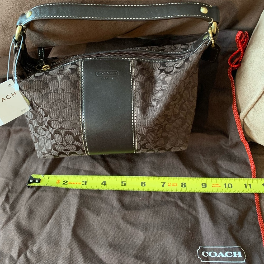 NWT SIGNATURE COACH BROWN HAND POUCH